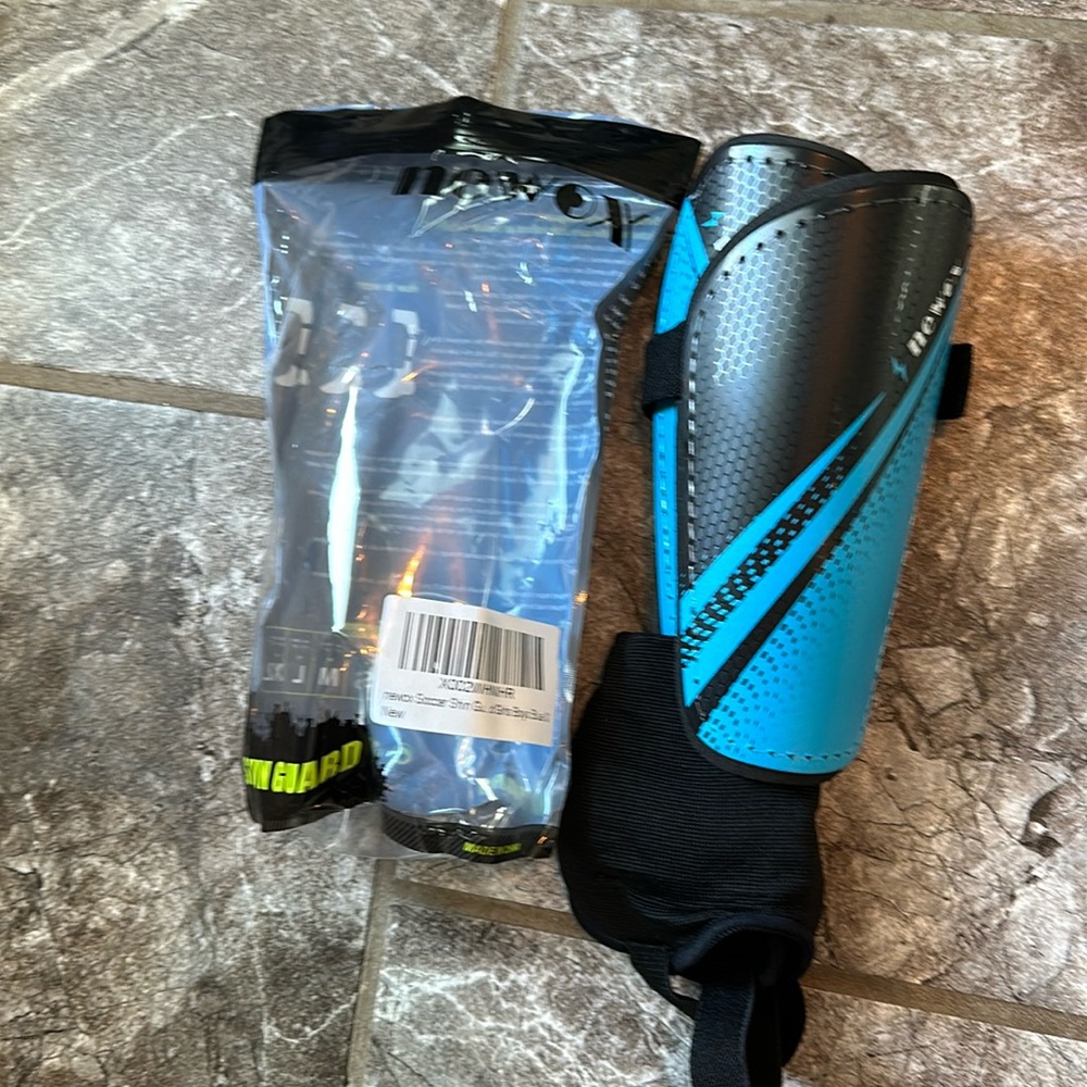 Brand new kids size M shin guards